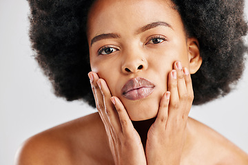 Image showing Portrait, black woman and touch face for skincare, aesthetic glow and soft dermatology on white background. Female model, natural beauty and afro hair in studio for shine, healthy facial or self care