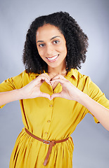 Image showing Heart, sign and happy woman for fashion portrait with thank you, support and hands emoji on a white background. Face, trendy clothes and young african person or model with self care or love in studio