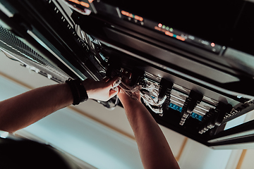 Image showing Close up of technician setting up network in server room