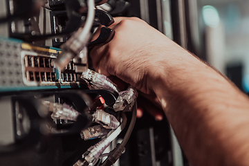 Image showing Close up of technician setting up network in server room