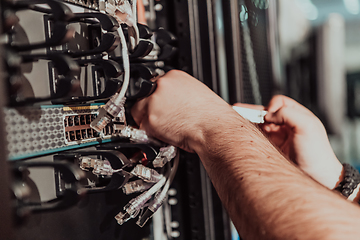 Image showing Close up of technician setting up network in server room