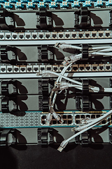 Image showing Close up of technician setting up network in server room