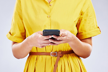 Image showing Phone, chat or hands of woman in studio on social media, mobile app or internet web networking online. Texting, research or closeup of person typing on digital technology web on white background