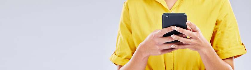 Image showing Phone, banner or hands of person in studio scrolling on social media, mobile app or internet. Online, research or closeup of woman typing on digital technology on white background with mock up space