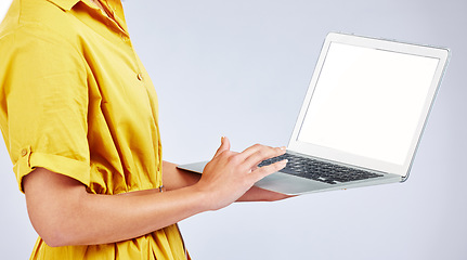 Image showing Woman hands, laptop screen and presentation mockup, e commerce advertising and fashion or creative website in studio. Person typing on computer with space or search information on a white background