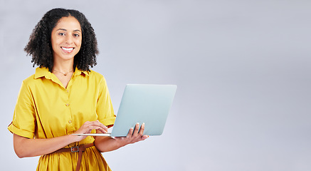 Image showing Happy, mockup and portrait of a woman with a laptop for communication, email or internet. Smile, corporate and a girl or employee typing on a computer with space isolated on a studio background