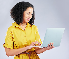 Image showing Laptop, typing and business woman for online marketing, social media planning and copywriting research. Editing, blog and creative worker or African person on computer on a white background in studio