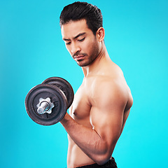 Image showing Weightlifting, fitness and man with dumbbell training, exercise or workout isolated in a studio blue background. Bodybuilder, wellness and healthy young person doing body or bicep strength endurance