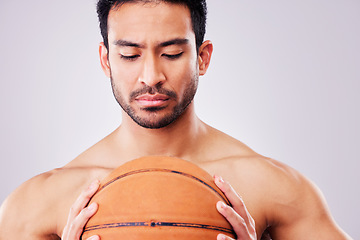 Image showing Fitness, basketball and a shirtless sports man in studio on a gray background for training or a game. Exercise, workout or mindset and a young male athlete holding a ball with focus or confidence