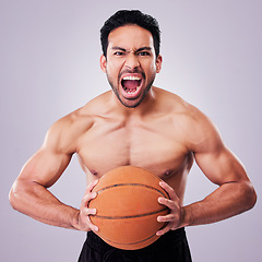 Image showing Portrait, basketball and a sports man shouting in studio on a gray background for training or a game. Fitness, body and aggression with a young male athlete holding a ball while screaming in anger