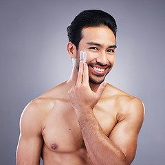 Image showing Beauty, skincare or portrait of happy man with face cream or sunscreen product in grooming routine with cosmetics. Dermatology, studio background or male model smiling or applying facial cream lotion