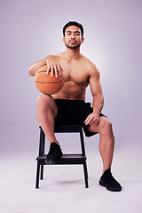 Image showing Portrait, fitness and basketball with a man on a chair in studio on a gray background for training or a game. Exercise, workout or mindset and confident young male sports athlete sitting with a ball