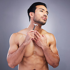 Image showing Beard hair, razor or studio man with beauty routine, self care treatment, morning grooming and cosmetic skincare. Facial cleaning, spa salon wellness or person with shaving product on grey background