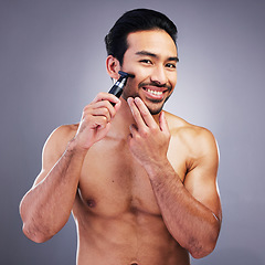 Image showing Beard hair trimmer, portrait or happy man with bathroom routine, grooming or morning smile for shaving skincare. Face cleaning, facial growth maintenance or studio person happiness on gray background