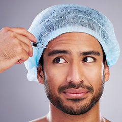 Image showing Hand, face and needle with a man in studio on a gray background for silicon injection. Facelift, beauty and plastic surgery with a male customer in a clinic for antiaging filler or cosmetics