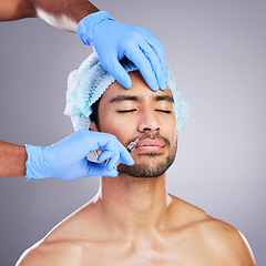 Image showing Hands, face and change with a man in studio on a gray background for a silicon injection. Beauty, plastic surgery or transformation with a male customer in a clinic for antiaging filler and cosmetics