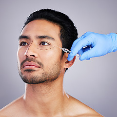 Image showing Beauty, plastic surgery and injection with face of man in studio for prp, aesthetics and collagen. Spa, skincare and dermatology with person on gray background for facial, cosmetics and filler