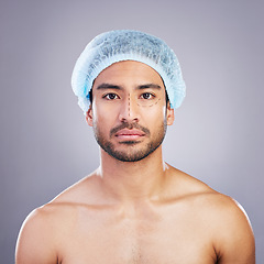 Image showing Portrait, skincare and man with plastic surgery, change and beauty enhancement against a grey studio background. Face, male person and model with transformation, facial dermatology and aesthetic