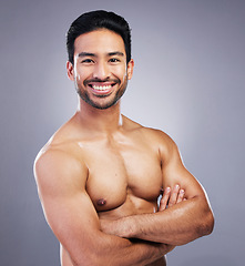 Image showing Skincare portrait, studio arms crossed and happy man with morning treatment, hygiene health or body wellness. Bathroom, self care and confident person smile for cosmetics results on gray background