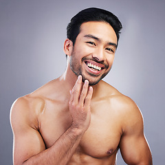 Image showing Portrait, skincare and man with cosmetics, facial and dermatology on grey studio background. Face, male person or happy Asian model with grooming, body muscle and health with wellness, beard or glow