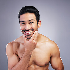 Image showing Portrait, skincare and man with facial, cosmetics and natural beauty against a grey studio background. Face, male person and model with grooming routine, muscle and health with wellness and aesthetic