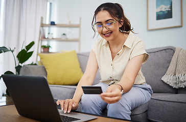 Image showing Woman, credit card and ecommerce on laptop in home for digital payment, fintech password and online shopping. Happy female customer, computer and banking code for financial bills, budget and account