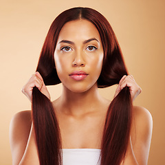 Image showing Haircare, beauty and portrait of woman with strong hair and luxury salon treatment on brown background. Aesthetic glow, haircut and care, natural face of model with cosmetics and makeup in studio.