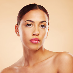 Image showing Portrait, skincare and woman with beauty, dermatology and makeup against a brown studio background. Face, female person and model with wellness, aesthetic or cosmetics with health, glow and shine
