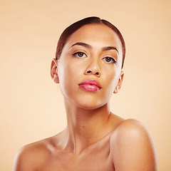 Image showing Portrait, dermatology and woman with skincare, cosmetics and luxury against a brown studio background. Face, female person or model with wellness, makeup or healthy skin with shine, glow or aesthetic