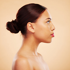 Image showing Skincare, makeup and side face of a woman on a studio background for natural and healthy wellness. Serious, facial and a girl with beauty, cosmetics and showing headshot profile on a backdrop