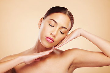 Image showing Face, calm or woman with natural beauty in studio isolated on brown background for wellness or glow. Skin care shine, hands or zen Brazilian girl model with self love, eyes closed or facial cosmetics