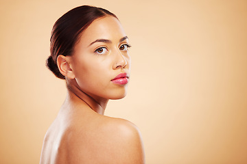 Image showing Portrait, beauty and woman with skincare, cosmetics and dermatology against a brown studio background. Face, female person or model with natural makeup and healthy skin with shine, glow and aesthetic