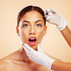 Image showing Surprise, woman or face in plastic surgery injection for facelift or cosmetics isolated on studio background. Forehead portrait, wow or shocked model with needle for skin beauty in medical procedure