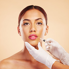 Image showing Portrait, woman or plastic surgery with a needle, lip filler and cosmetics isolated on studio background. Hands, lips or face of model with injection, dermatology and beauty with medical procedure