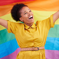 Image showing Pride, flag and happy black woman in studio for gay, rights and lgbtq life or choice. Rainbow, freedom and lesbian African female celebrating, smile and confident with inclusion and support