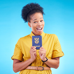 Image showing African woman, passport and studio with smile, thinking or wow for compliance, identity or travel by blue background. Happy student girl, surprise and ideas for immigration document in South Africa