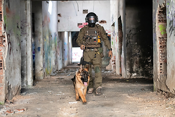 Image showing Modern Warfare Soldiers with military working dog in action on the battlefield.