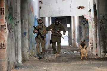 Image showing Modern Warfare Soldiers with military working dog in action on the battlefield.