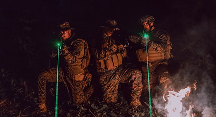 Image showing Soldiers squad in action on night mission using laser sight beam lights military team concept