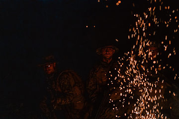 Image showing Soldiers squad in action on night mission using laser sight beam lights military team concept