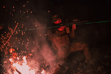 Image showing Soldiers squad in action on night mission using laser sight beam lights military team concept