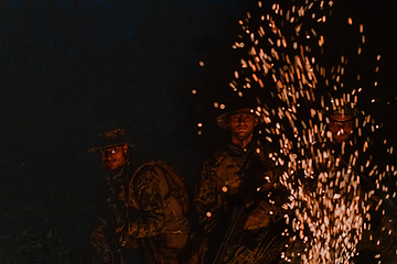 Image showing Soldiers squad in action on night mission using laser sight beam lights military team concept