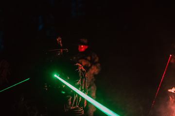 Image showing Soldiers squad in action on night mission using laser sight beam lights military team concept