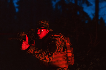 Image showing Soldiers squad in action on night mission using laser sight beam lights military team concept