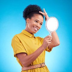 Image showing Happy, beauty and a woman with a mirror in studio for hair care, confidence and appearance. Fashion, makeup and cosmetics of African female model person in casual style clothes on a blue background