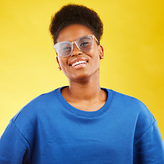 Image showing Woman, smile and studio portrait with glasses and happy with eye care and yellow background. Face, African female person and model with eyewear, frame and fashion with style and confidence of girl