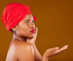 Image showing Beauty, makeup and presentation with face of black woman in studio for cosmetics, creative and show. Skincare, salon and mockup with female model on brown background for wellness, self care and glow