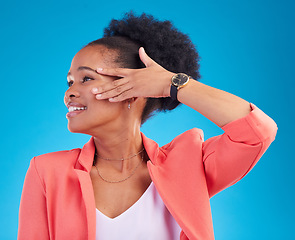 Image showing Fashion, smile and a model black woman on a blue background in studio posing in a suit for style. Face, clothes and a happy young female person standing in a trendy outfit for a magazine cover