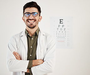 Image showing Eye exam, arms crossed and portrait of man optometrist with smile, confidence and friendly service in consultation office. Ophthalmology, face and happy male eye expert proud of vision testing career