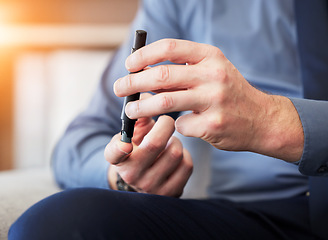 Image showing Man, hands and test blood sugar for diabetes, health analysis or medical glucometer results in office. Closeup of worker poke finger with needle to check insulin, monitor glucose or diabetic medicine